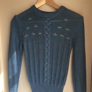 Blue sweater with embroidered flowers